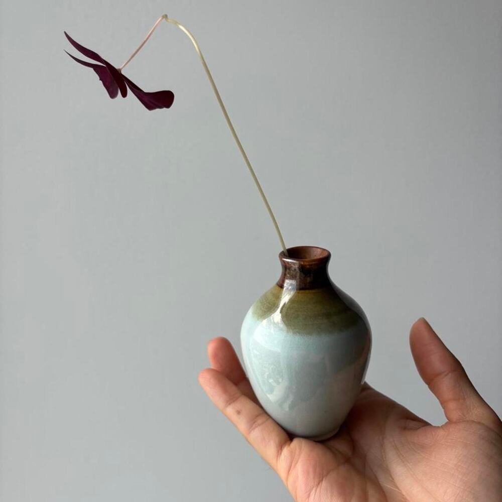 Signed studio pottery bud vase with pale blue celadon-style glaze